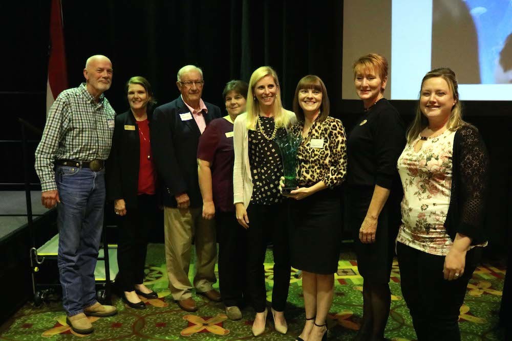 Foundation for Springfield Public Schools Executive Director Natalie Murdock, third from right, honors Bass Pro Shops as Corporate Partner of the Year. Pictured from left are Larry Whiteley, Janet Furneaux, Edsel Matthews, Misty Mitchell, Catherine Bass Black, Murdock, Sue Dial and Courtney Reece.